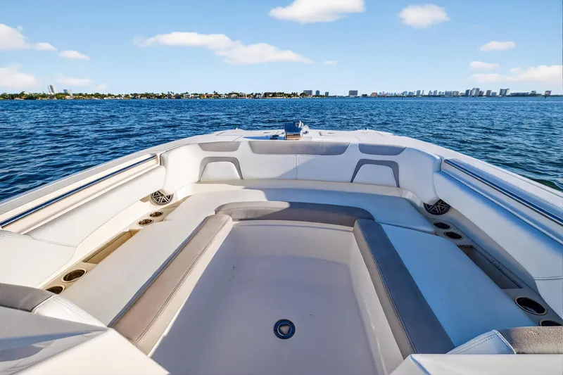  Yacht Photos Pics 2017 World Cat 295 DC boat interior with ocean view and city skyline.