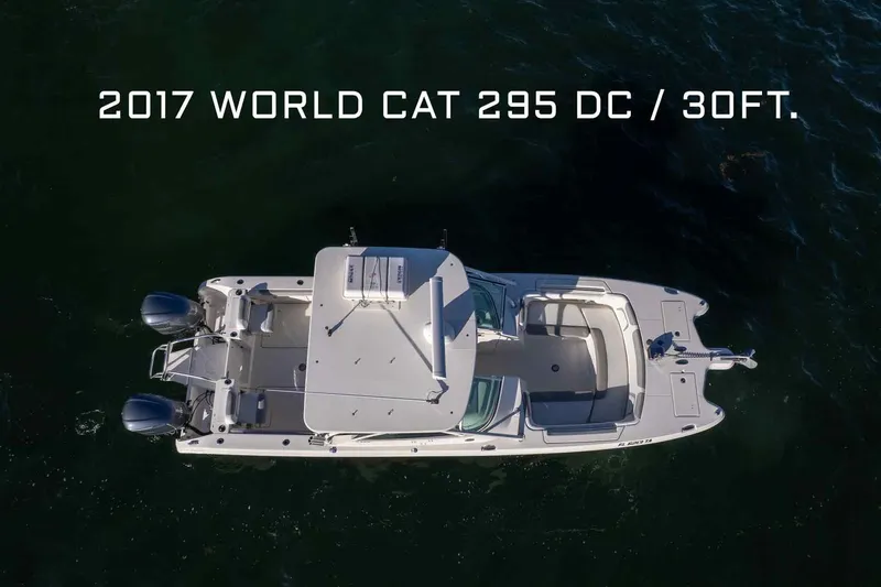  Yacht Photos Pics Aerial view of 2017 World Cat 295 DC boat on water, 30 feet long.