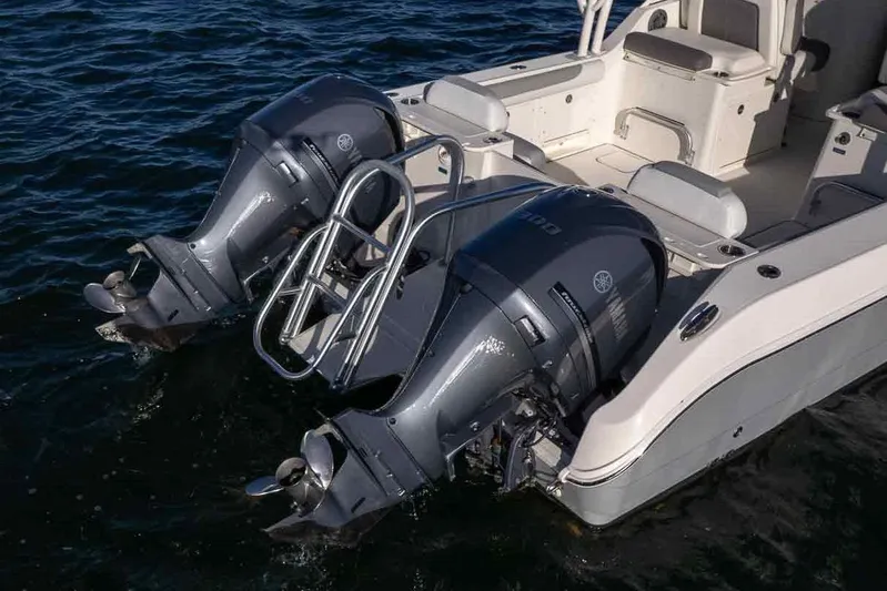  Yacht Photos Pics 2017 World Cat 295 DC boat with dual outboard engines on water.