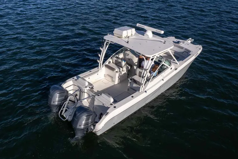  Yacht Photos Pics 2017 World Cat 295 DC boat on open water, featuring dual Yamaha engines.
