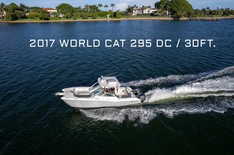 Yacht Photos Pics 2017 World Cat 295 DC boat cruising on water, aerial view.
