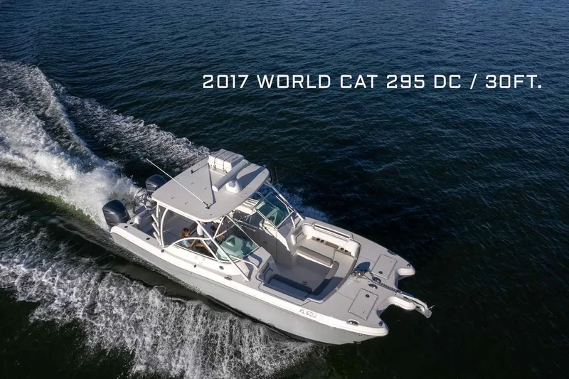  Yacht Photos Pics 2017 World Cat 295 DC boat cruising on open water, aerial view.