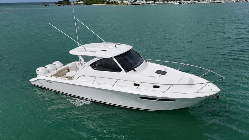  Yacht Photos Pics 2019 Pursuit OS 355 Offshore boat on clear blue water.