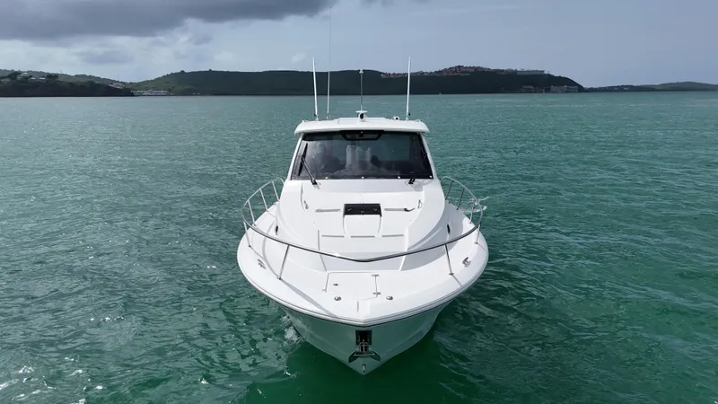  Yacht Photos Pics 2019 Pursuit OS 355 Offshore boat on calm water, front view.
