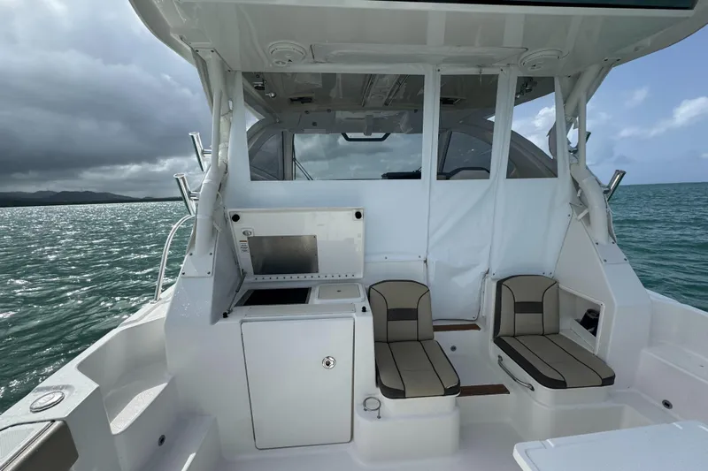  Yacht Photos Pics 2019 Pursuit OS 355 Offshore boat interior with seating and ocean view.