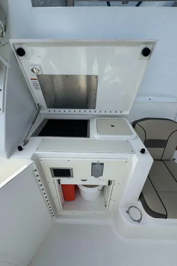  Yacht Photos Pics 2019 Pursuit OS 355 Offshore boat interior with storage and seating area.