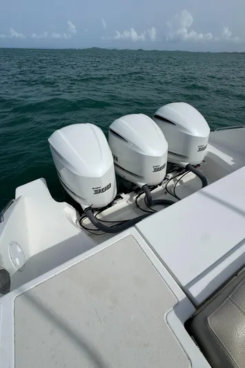  Yacht Photos Pics 2019 Pursuit OS 355 Offshore boat with triple Yamaha 300 engines on open water.