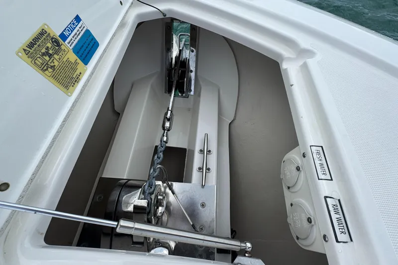  Yacht Photos Pics Anchor compartment of 2019 Pursuit OS 355 Offshore boat with water access points.