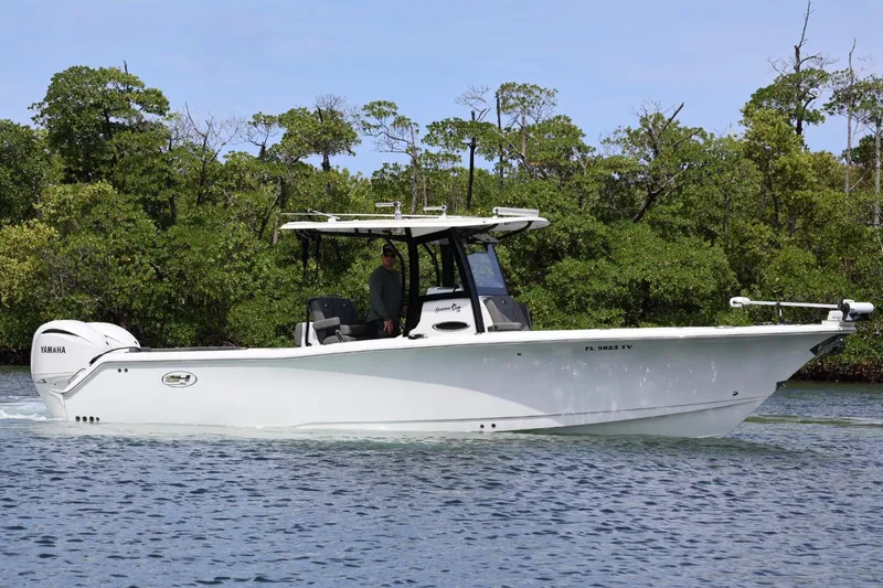  Yacht Photos Pics 2022 Sea Hunt Gamefish 30 Coffin Box boat cruising on a calm waterway.