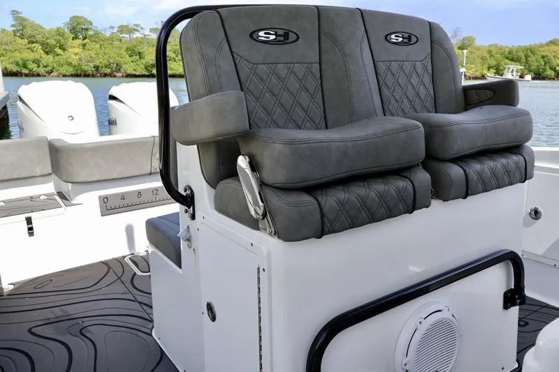  Yacht Photos Pics 2022 Sea Hunt Gamefish 30 Coffin Box boat seating with dual engines in scenic water setting.