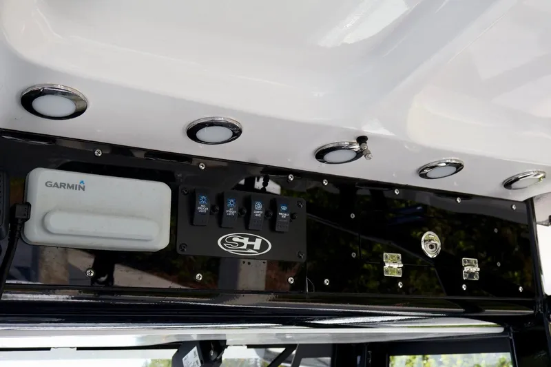  Yacht Photos Pics 2022 Sea Hunt Gamefish 30 Coffin Box dashboard with Garmin electronics and control switches.