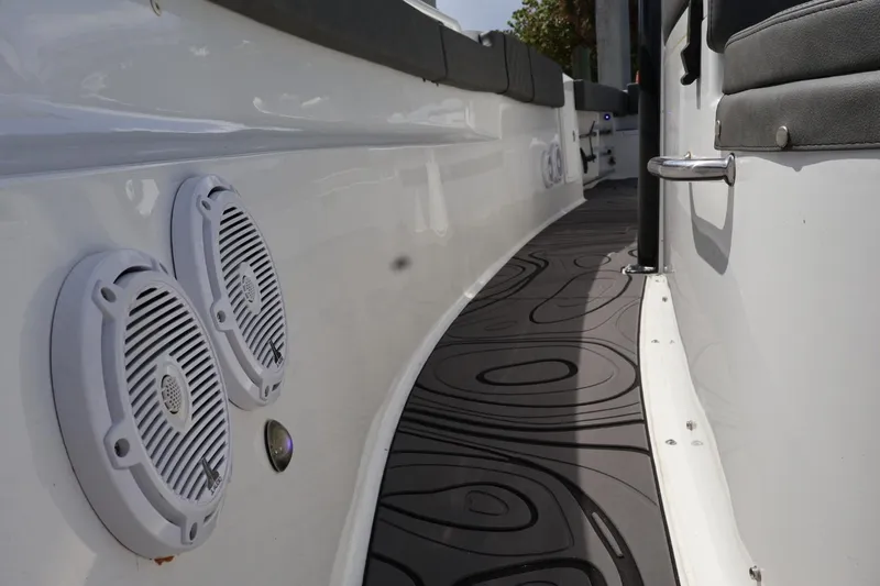  Yacht Photos Pics 2022 Sea Hunt Gamefish 30 Coffin Box boat interior with speakers and cushioned seating.