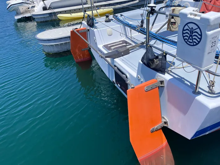 Yippee Kai Yay Yacht Photos Pics Sailboat with orange rudders docked in marina, Class 40 Antrim Design, 2009 model.