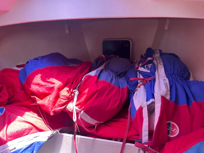 Yippee Kai Yay Yacht Photos Pics Sailboat interior with colorful sails stored, Class 40 Antrim Design, 2009 model.
