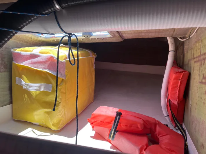 Yippee Kai Yay Yacht Photos Pics Storage compartment with yellow and red safety gear, Class 40 Antrim Design, 2009.