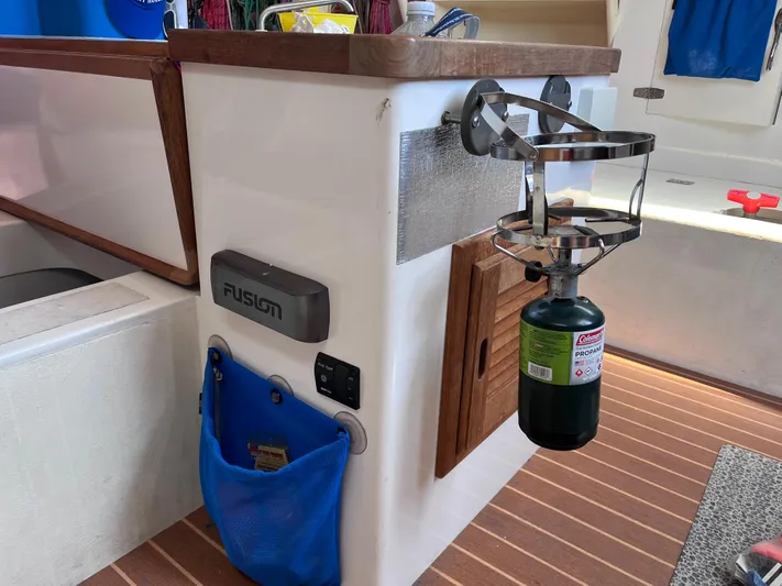 Yippee Kai Yay Yacht Photos Pics Interior of 2009 Class 40 Antrim Design boat with propane tank holder and Fusion audio system.