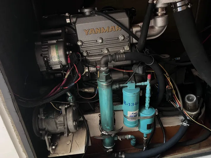 Yippee Kai Yay Yacht Photos Pics Engine compartment of a 2009 Class 40 Antrim Design boat, featuring a Yanmar engine.