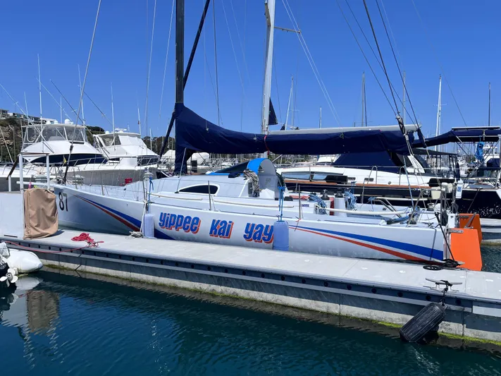 Yippee Kai Yay Yacht Photos Pics Class 40 Antrim Design sailboat docked, 2009 model, with "yippee kai yay" text on hull.