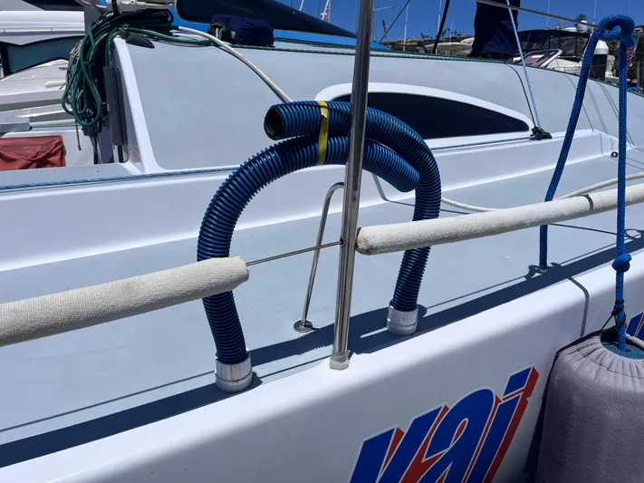 Yippee Kai Yay Yacht Photos Pics Sailboat deck with blue hoses, Class 40 Antrim Design, 2009 model.