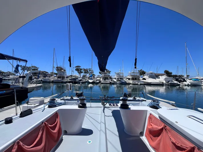 Yippee Kai Yay Yacht Photos Pics Sailboat docked in marina, Class 40 Antrim Design, 2009, with clear blue sky.