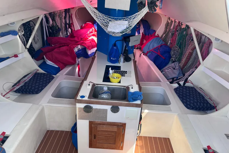 Yippee Kai Yay Yacht Photos Pics Interior of 2009 Class 40 Antrim Design sailboat with compact kitchen and storage.