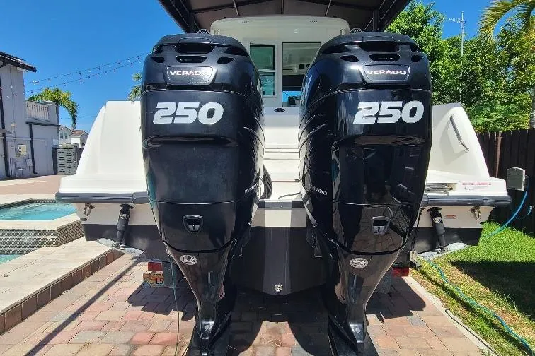 The Snapper Slapper Yacht Photos Pics 2014 Boston Whaler 315 Conquest Pilothouse with twin 250 Verado engines, docked outdoors.