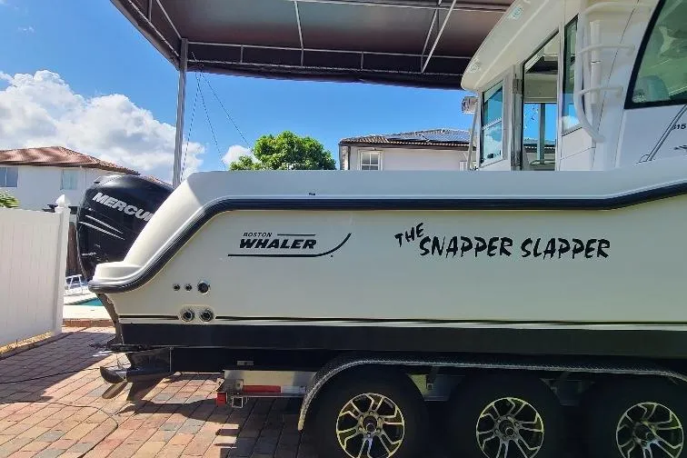 The Snapper Slapper Yacht Photos Pics 2014 Boston Whaler 315 Conquest Pilothouse boat on trailer, named "The Snapper Slapper."