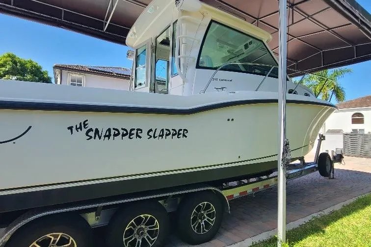 The Snapper Slapper Yacht Photos Pics 2014 Boston Whaler 315 Conquest Pilothouse boat on trailer, named "The Snapper Slapper."