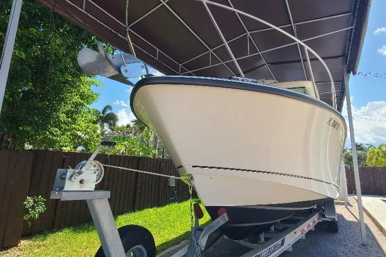 The Snapper Slapper Yacht Photos Pics 2014 Boston Whaler 315 Conquest Pilothouse on trailer under canopy.