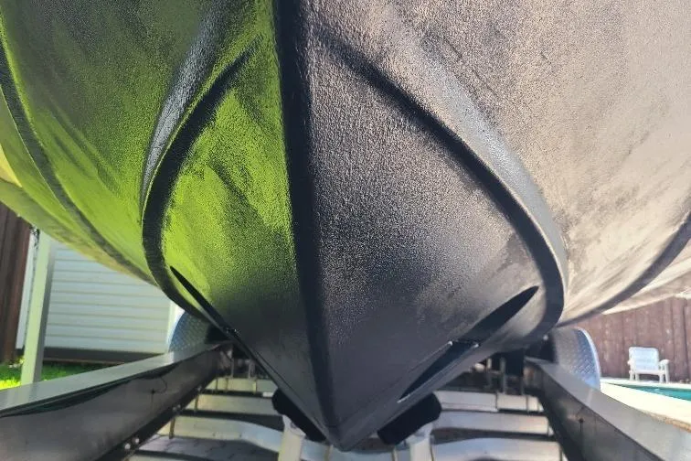 The Snapper Slapper Yacht Photos Pics 2014 Boston Whaler 315 Conquest Pilothouse hull on trailer, close-up view.