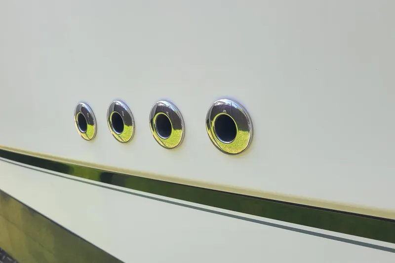 The Snapper Slapper Yacht Photos Pics Close-up of 2014 Boston Whaler 315 Conquest Pilothouse portholes on white hull.