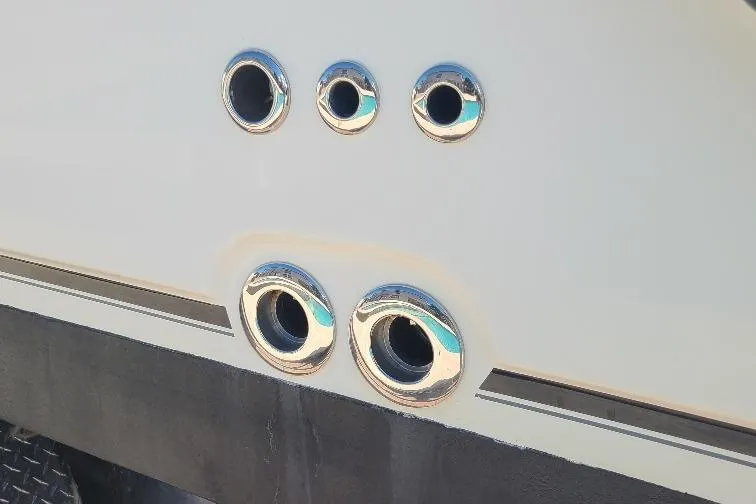 The Snapper Slapper Yacht Photos Pics Chrome fittings on a 2014 Boston Whaler 315 Conquest Pilothouse boat hull.