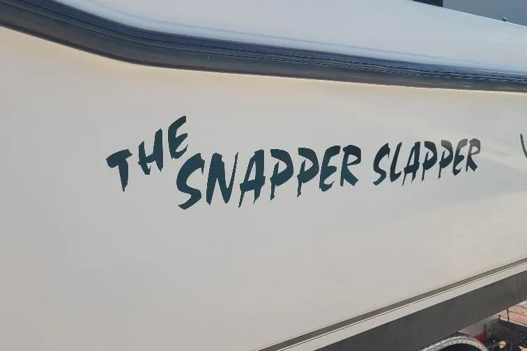 The Snapper Slapper Yacht Photos Pics 2014 Boston Whaler 315 Conquest Pilothouse with "The Snapper Slapper" name on hull.