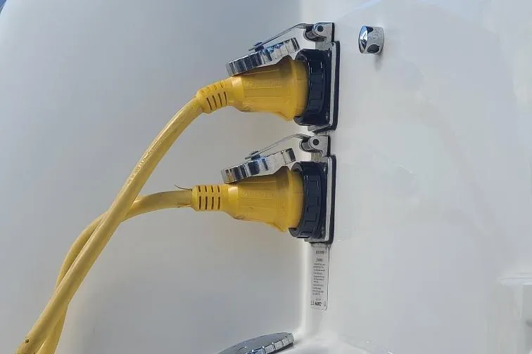The Snapper Slapper Yacht Photos Pics Yellow power cables connected to a 2014 Boston Whaler 315 Conquest Pilothouse.