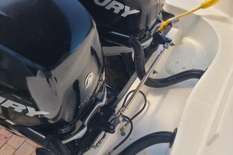 The Snapper Slapper Yacht Photos Pics Twin Mercury outboard engines on a 2014 Boston Whaler 315 Conquest Pilothouse boat.