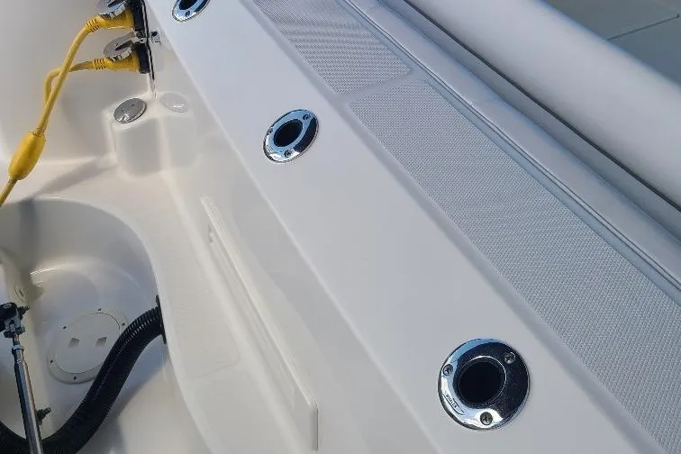 The Snapper Slapper Yacht Photos Pics 2014 Boston Whaler 315 Conquest Pilothouse deck with rod holders and power connections.