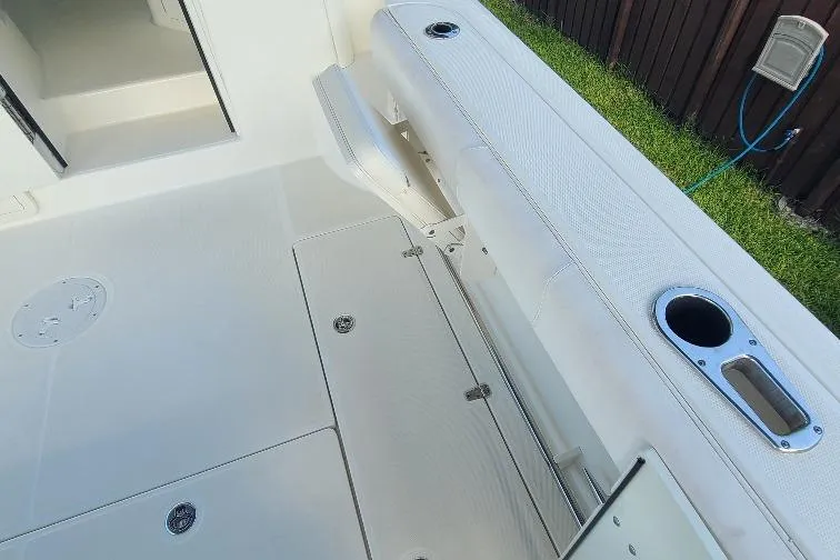 The Snapper Slapper Yacht Photos Pics 2014 Boston Whaler 315 Conquest Pilothouse deck with seating and cup holders.