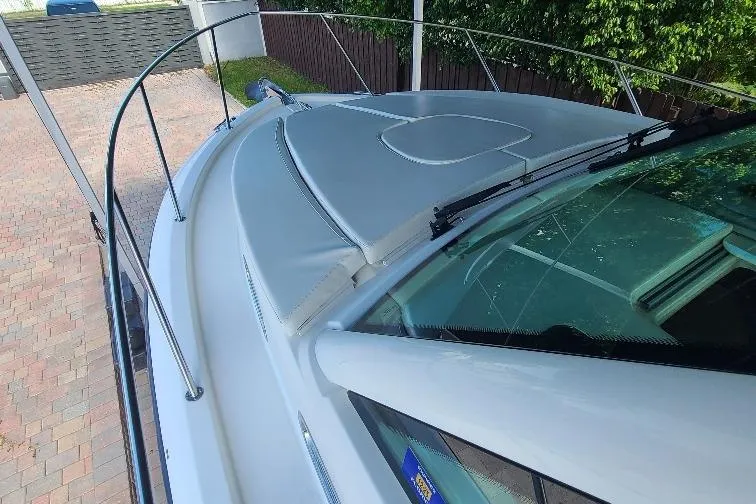 The Snapper Slapper Yacht Photos Pics 2014 Boston Whaler 315 Conquest Pilothouse boat deck with railing and sunroof.