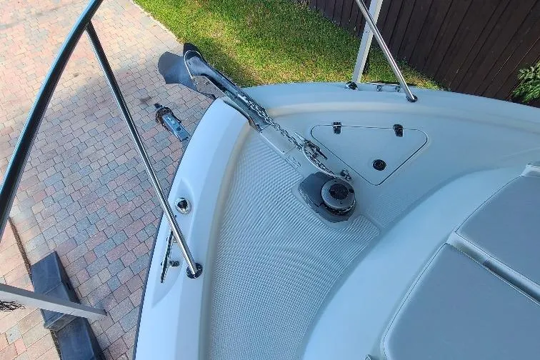 The Snapper Slapper Yacht Photos Pics 2014 Boston Whaler 315 Conquest Pilothouse bow with anchor and railing.