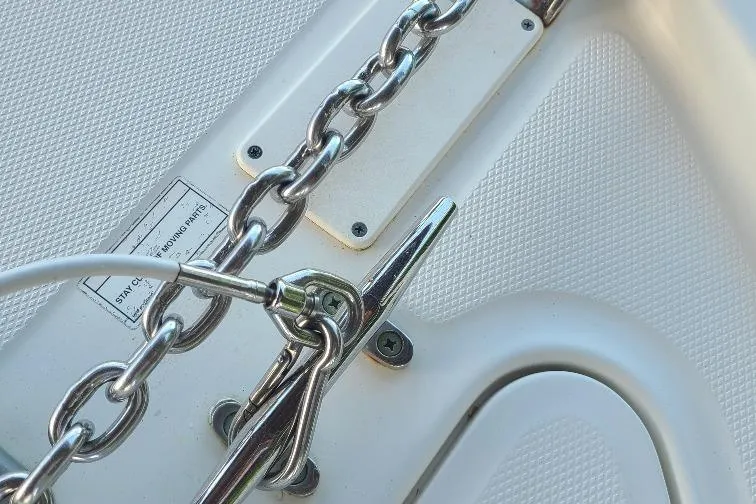 The Snapper Slapper Yacht Photos Pics Close-up of a 2014 Boston Whaler 315 Conquest Pilothouse boat chain and cleat.