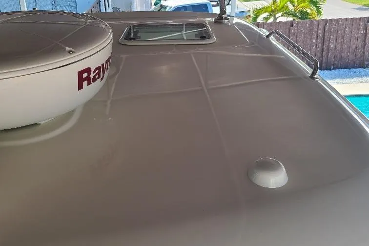 The Snapper Slapper Yacht Photos Pics Rooftop view of 2014 Boston Whaler 315 Conquest Pilothouse with radar and hatch.