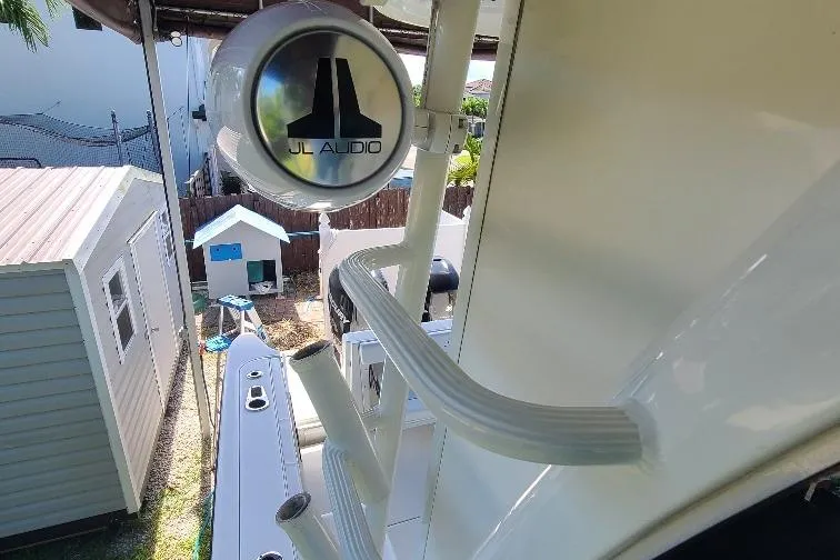 The Snapper Slapper Yacht Photos Pics 2014 Boston Whaler 315 Conquest Pilothouse with JL Audio speaker, outdoor view.