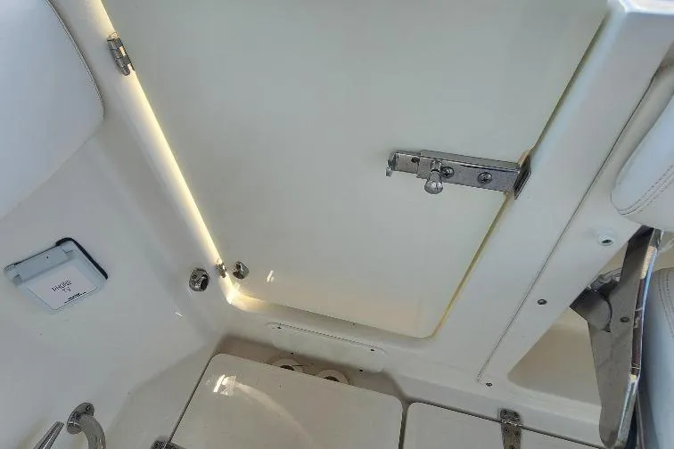 The Snapper Slapper Yacht Photos Pics Interior view of a 2014 Boston Whaler 315 Conquest Pilothouse, featuring a secure latch.