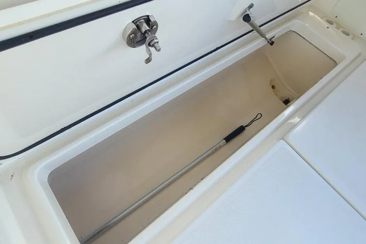 The Snapper Slapper Yacht Photos Pics Storage compartment of 2014 Boston Whaler 315 Conquest Pilothouse boat, open and empty.