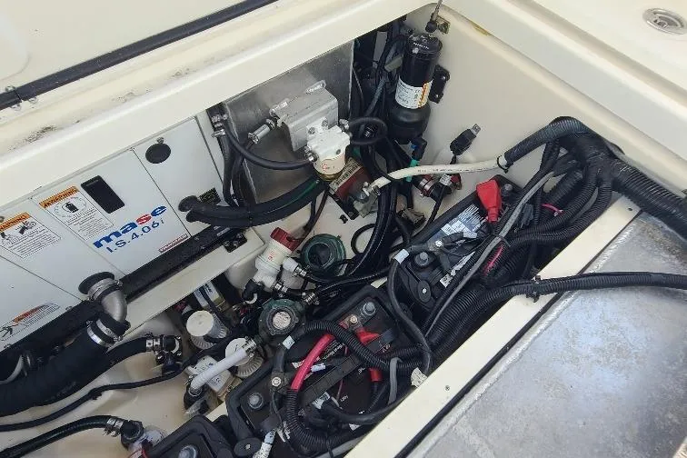The Snapper Slapper Yacht Photos Pics Engine compartment of 2014 Boston Whaler 315 Conquest Pilothouse with wiring and components.