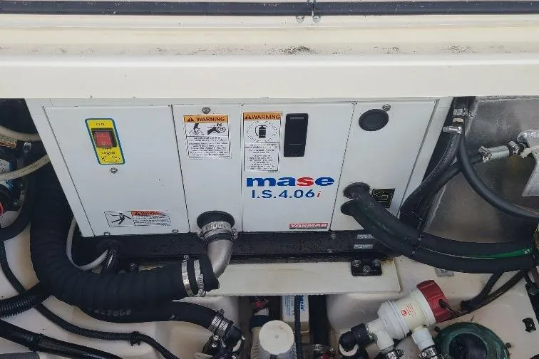 The Snapper Slapper Yacht Photos Pics Engine compartment of a 2014 Boston Whaler 315 Conquest Pilothouse with Mase I.S.4.0 generator.