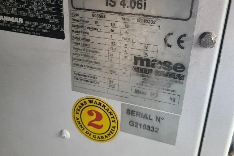 The Snapper Slapper Yacht Photos Pics Label on Mase generator with warranty sticker, serial number G210332, on 2014 Boston Whaler 315 Conquest Pilothouse.