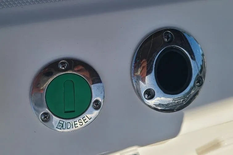 The Snapper Slapper Yacht Photos Pics 2014 Boston Whaler 315 Conquest Pilothouse diesel fuel cap and port detail.