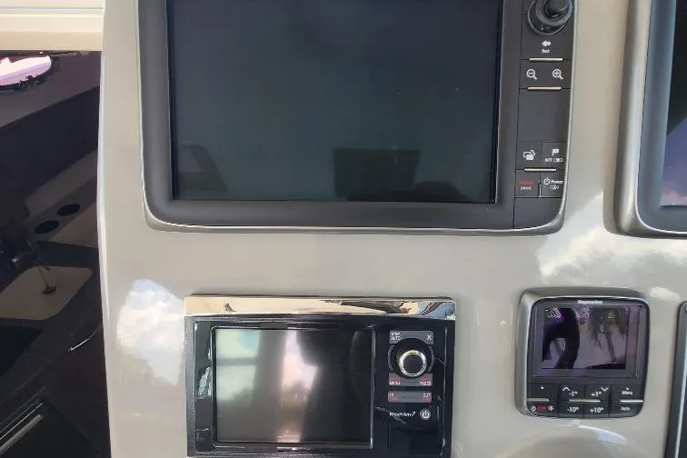 The Snapper Slapper Yacht Photos Pics Dashboard of 2014 Boston Whaler 315 Conquest Pilothouse with navigation screens.