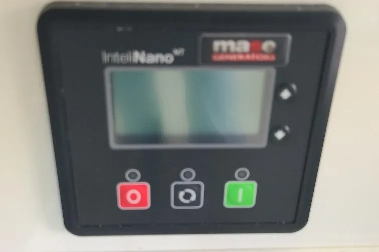 The Snapper Slapper Yacht Photos Pics Control panel on 2014 Boston Whaler 315 Conquest Pilothouse with buttons and display.